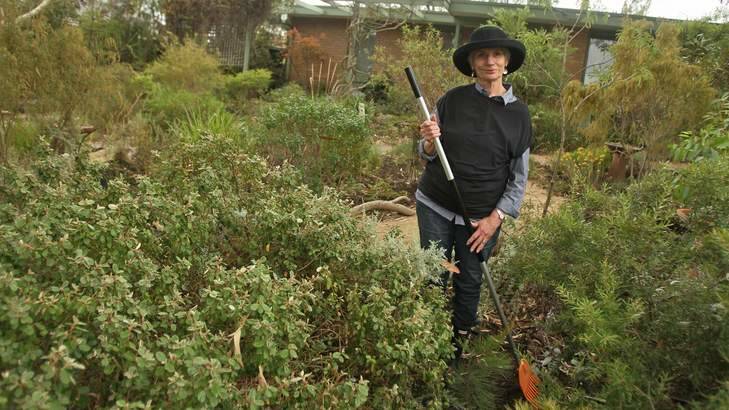 Diane Cummins in her garden, home to native flora as well as chooks and various wildlife. Photo: Ken Irwin