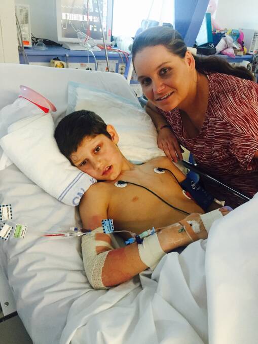 Horrible time: Caleb Scott with mum Suzanne Turpie in hospital at the beginning of his treatment in 2015.