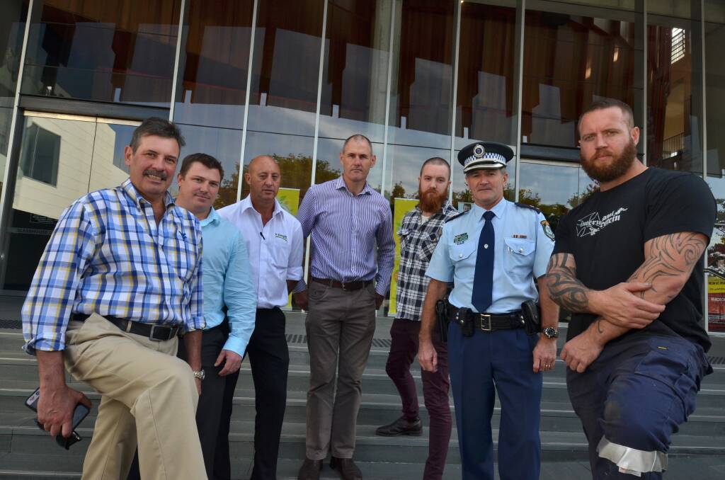 Taking action: today's White Ribbon Regional Forum will see anti-domestic violence advocates Walter DeKeseredy, Teale Bryan, Matt Dowse, Peter Besseling, Ben Cooper, Paul Fehon and Peter Bridge work with women on grassroots solutions. Pic: MATT ATTARD