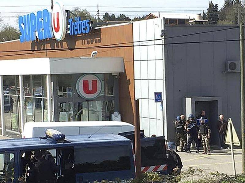 A hostage-taker has killed two people and taken hostages in a supermarket in southern France.