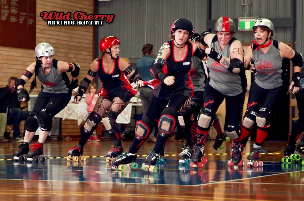 Too good: Port Macquarie Roller Derby League members in a big bout on Saturday.  
Pic: Wild Cherry Photography