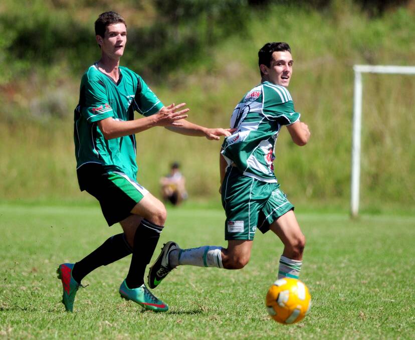 Eyes on the ball: Jake Avery and Lachlan Galea follow the progress of a pass in Port United's trial match with Kempsey Saints on Saturday. 	      Pic: MATT McLENNAN
