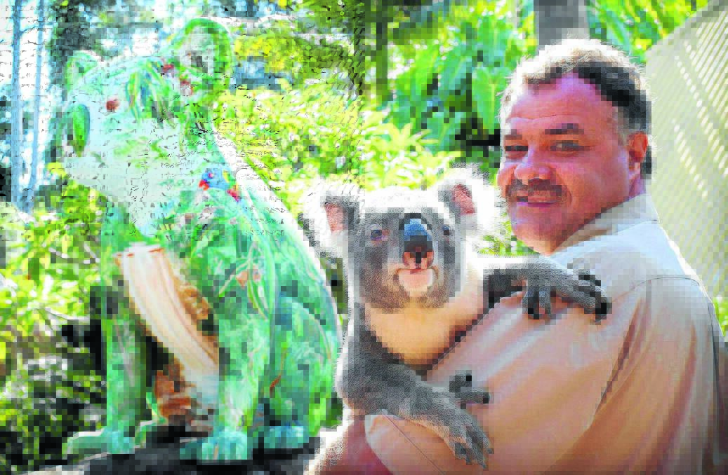 Quite a likeness: Stoney the koala, named after owner of Billabong Zoo, Koala and Wildlife Park Mark Stone, is quite impressed with his sculptured compatriot, painted by Bruce Whittaker, which will take pride of place at the park come September.