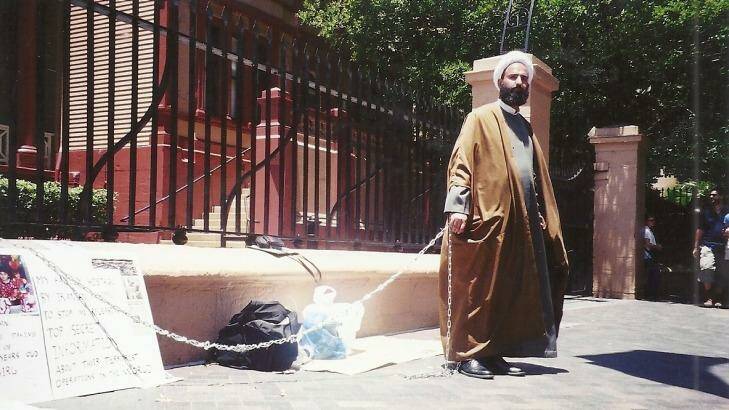 Man Haron Monis chained to the fence at Parliament House in 2001 Photo: Leigh Tonkin