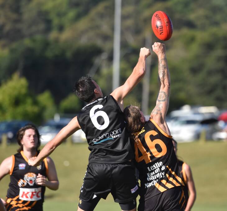 Eyes on the ball: Brice Hayward punches the ball during the Magpies 204-point win on Saturday.  
Pic: IVAN SAJKO