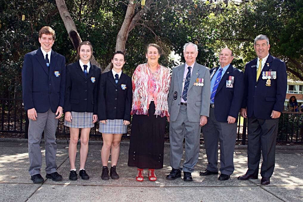 Lest we forget: School captains Rhys Boreham, Chantelle Cooper and Emma Piper with Port Macquarie High School Principal Lorraine Haddon, special guest speaker David Curry with Ray Chesher and Greg Laird from Port Macquarie R.S.L. Sub-branch.