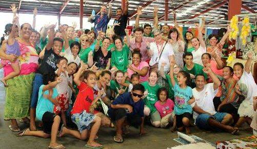 Loads of fun: CSU staff and students join locals after a zumba class they held for the stall holders and children at Fugalei Market in Apia.