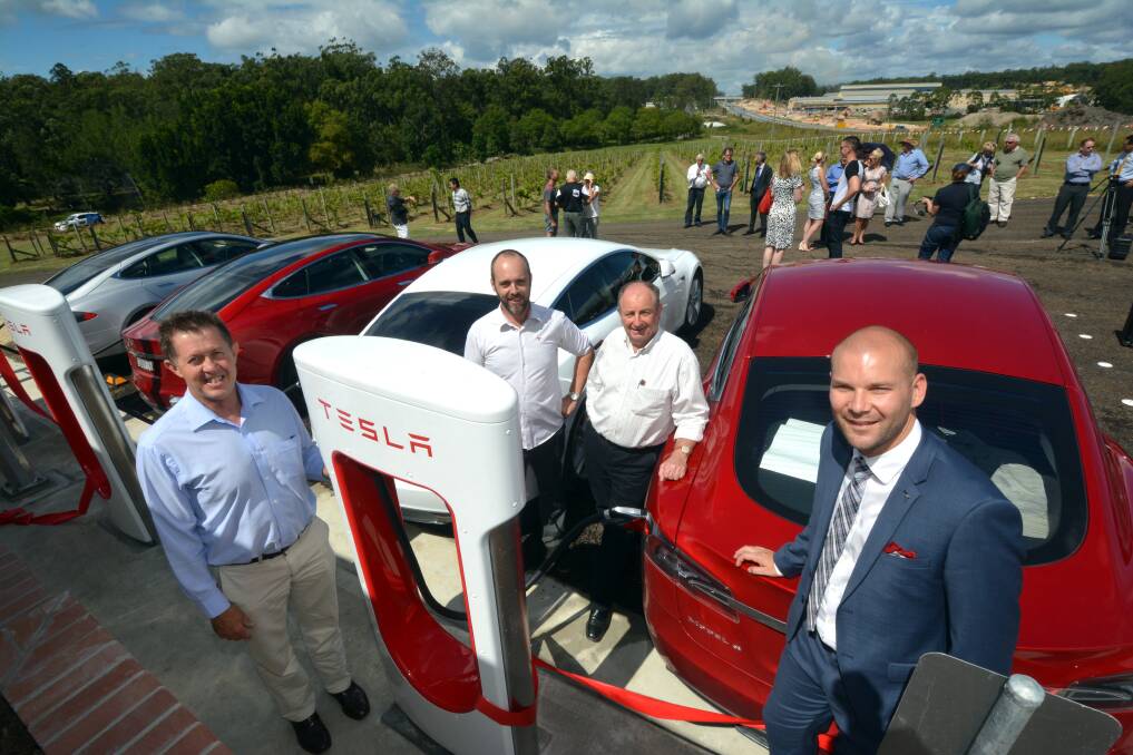 Electric refuel: Tesla Motors yesterday launched their supercharger station at Cassegrain. Federal Member for Cowper Luke Hartsuyker, Supercharger program manager Australia Evan Beaver, Cassegrain Winery's John Cassegrain and senior marketing and communications manager with Tesla, Heath Walker. Pic: Peter Gleeson