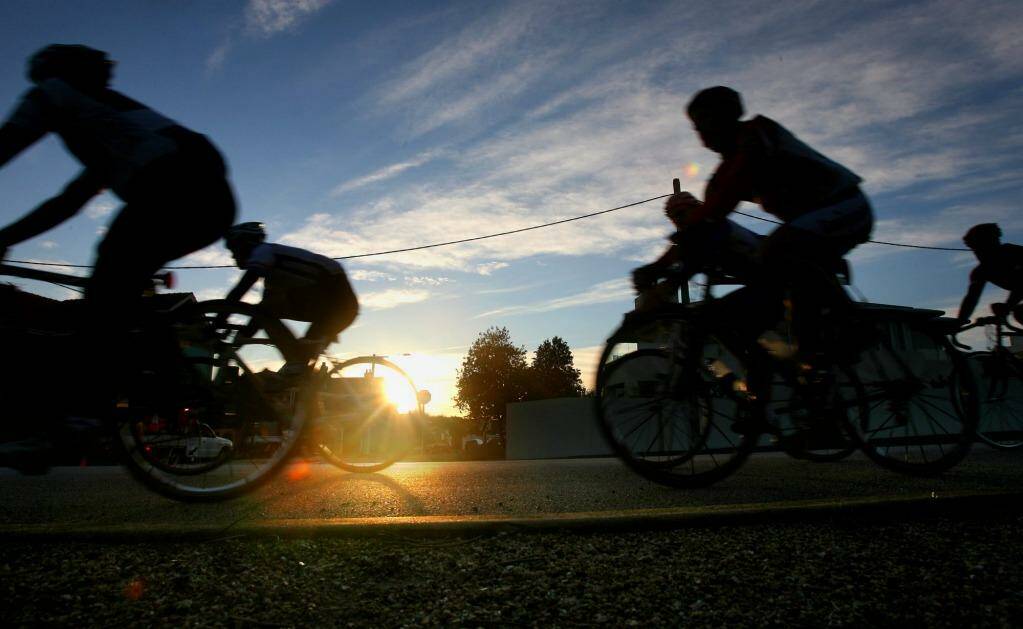 Dawn patrol: cyclists on Melbourne's Beach Road, which has a weekend clearway. 