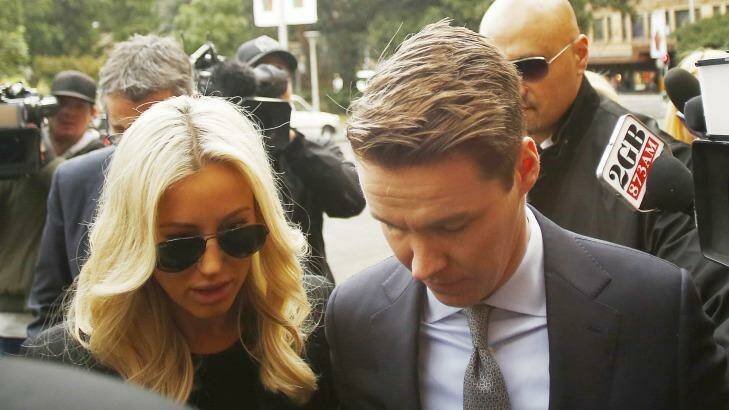 Insider trader Oliver Curtis and his wife Roxy Jacenko arrive at the NSW Supreme Court on Friday. Photo: Daniel Munoz