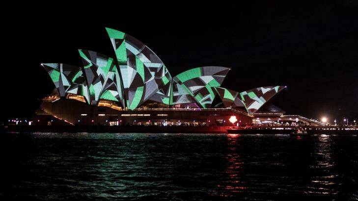 The sails take on a different hue during Vivid opening night. Photo: Cole Bennetts