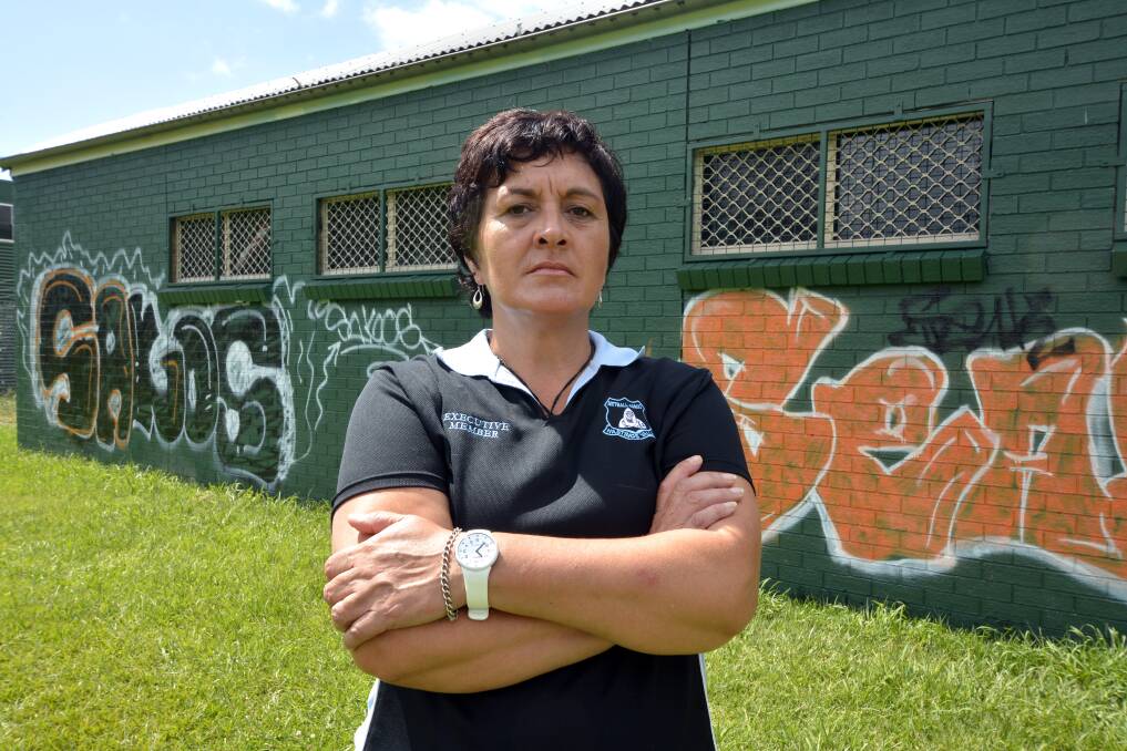Had enough: Helen Miles vows to beat Port Macquarie's graffiti vandals who repeatedly target the Macquarie Park netball clubhouse.  
Pic: PETER GLEESON