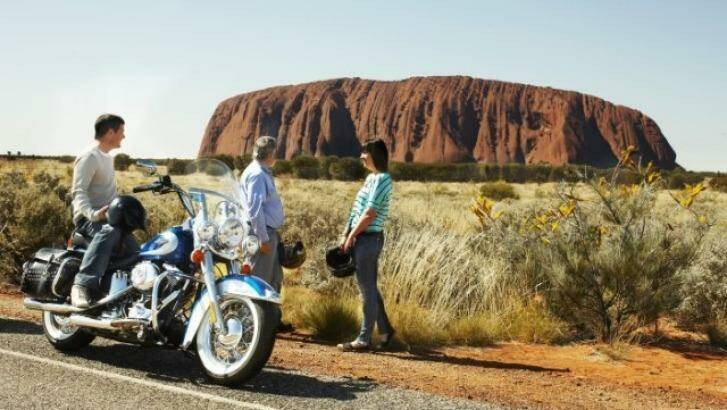 Ride around the rock on a Harley Davidson. Photo: Voyages Indigenous Tourism Austr
