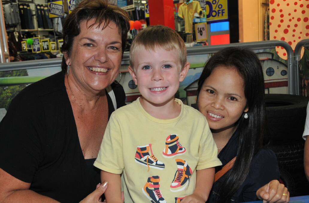 Kidtastic fun: The Bailey - Debbie, little Jayden and Som are having fun with creative colouring at Settlement City Shopping Centre this school holidays, where you can win a family trip to the USA including tickets to Disneyland Resort.