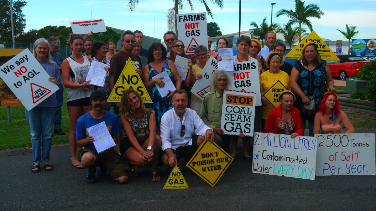 Not happy: A group of anti-coal-seam gas protesters at the Port Macquarie airport on Sunday.  