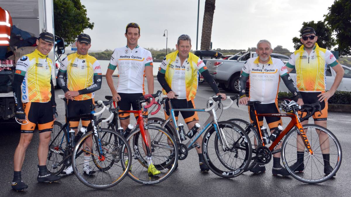 On yer bike: Some of the water logged cyclists about to head south from Rydges Port Macquarie on the Hadley Cycles Ride for Sick Kids to Newcastle - from left, Matt Taylor, Nathan Chiswell, Hayden Smith, Neil Beattie, Bill Cox and Henri Lecomte.