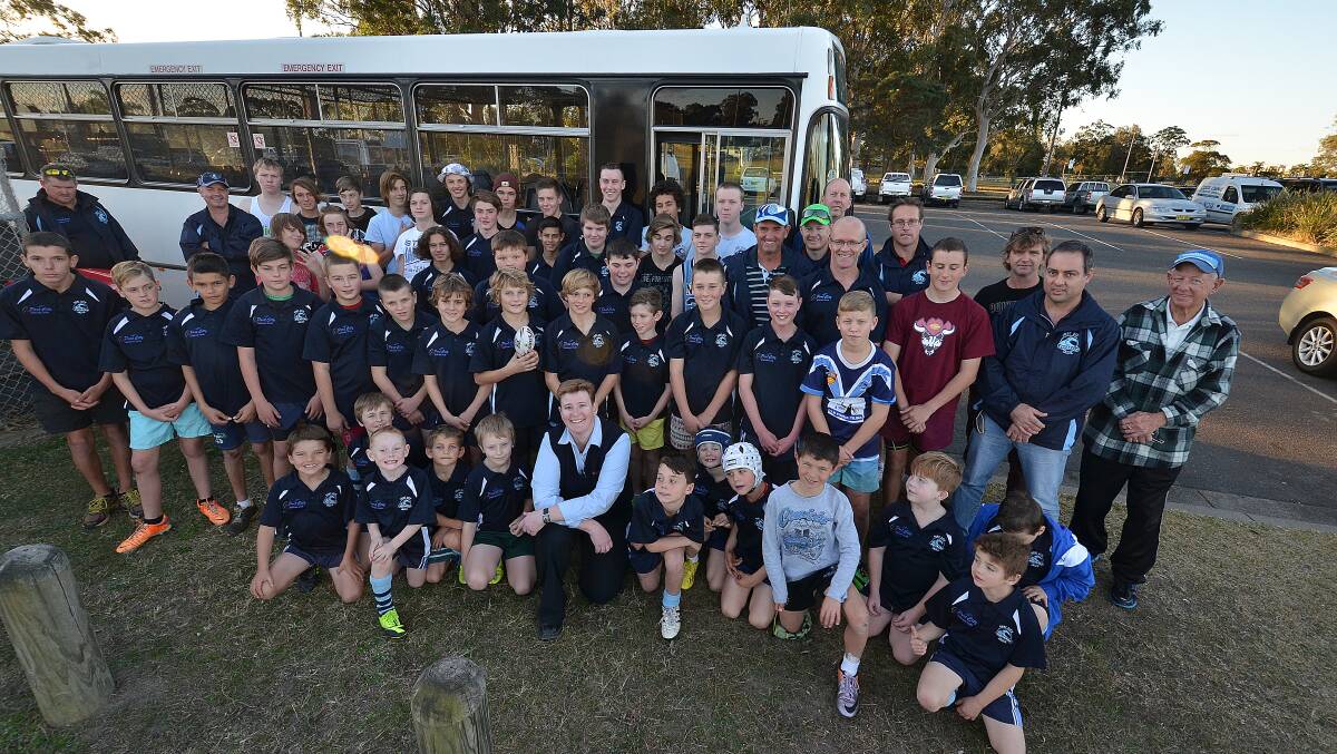 Set to go: Port City Breakers Under 8s, 12s and 15s with Busways driver Belinda Button, who will be driving the team to Forster to support injured footballer Curtis Landers. Pic: Nigel McNeil.