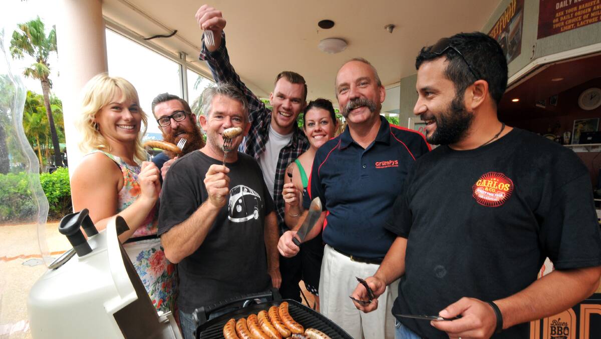 Ready to sizzle: The team at Carlos and Co Heidi Newson, Ash Benson, Sean Edwards, Andrew Stark, Ally Clover, Garry Waddell of Grumpys Butchery and Jarad Mea are ready to turn up the heat for this Saturday'scook-off at the inaugural Blues and BBQ Festival.