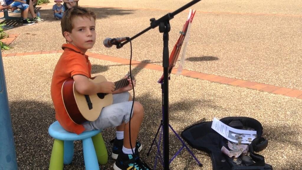 Hastings Public School student Cameron Alford wowed a crowd on the Town Green with his voice and ukulele tunes to help Rafael Moraes from Victoria travel to the FIFA World Cup in Brazil.