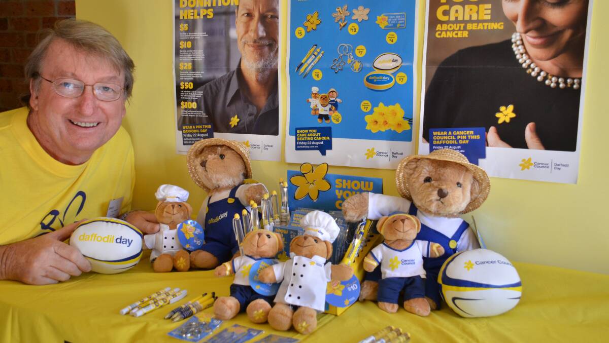 Helping cancer patients: Steve Scarlett is one of many volunteers who will support Daffodil Day on Friday by selling the distinctive yellow flowers, bears, pins, foam footies, pens and wrist bands across the Hastings and Camden Haven to raise funds for Cancer Council.