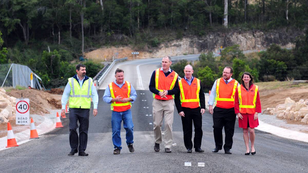 Work brought forward: Port Macquarie-Hastings Council group manager infrastructure delivery Gary Randall, Cr Mike Cusato, mayor Peter Besseling, council's development and environment director Matt Rogers, council's director infrastructure and asset management Jeffery Sharp and Cr Sharon Griffiths inspect the Beechwood roadworks west of Bain Bridge.
