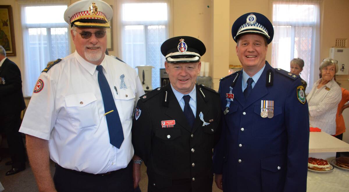 Taking a moment: Ambulance NSW's Inspector Steven Towle and Fire and Rescue NSW's Mark McGuire enjoyed catching up after commemorating their emergency colleagues with Acting Superintendent Tony Boice.   