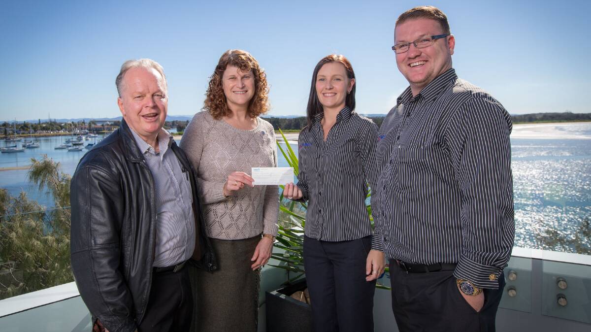 Helping hand: Mid North Coast Lifeline business manager Kurt Russell, chief executive officer Catherine Vaara with Rebecca Walker and Graeme Holm from Infinity Investment Group. The business donated $2000 toward lifeline's shop rebuild on Central Road.