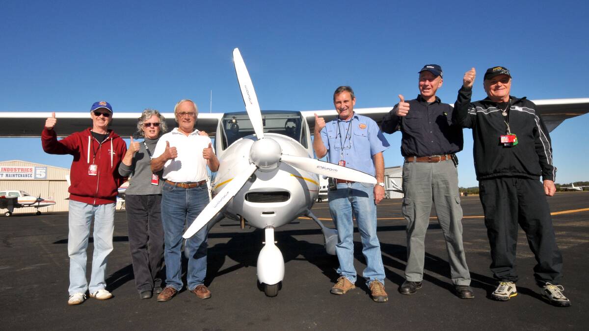High performance aircraft: Hastings District Flying Club members Eric Elsey, Lyndal and Bill Coote, president Rod Davison, member Vaughan Durkin and Australian distributor Leo Moras with the Flight Design CTLS after its arrival into Port Macquarie.