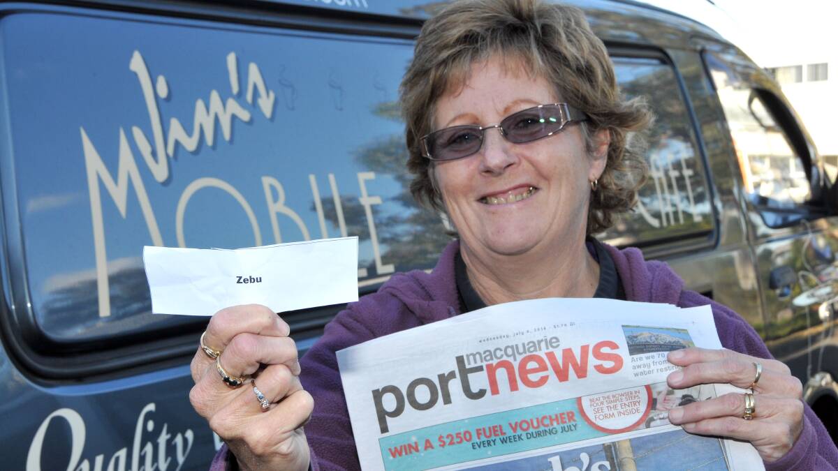 Suzi Gaskill from Jim's Mobile Coffee Cafe with the winning ticket.