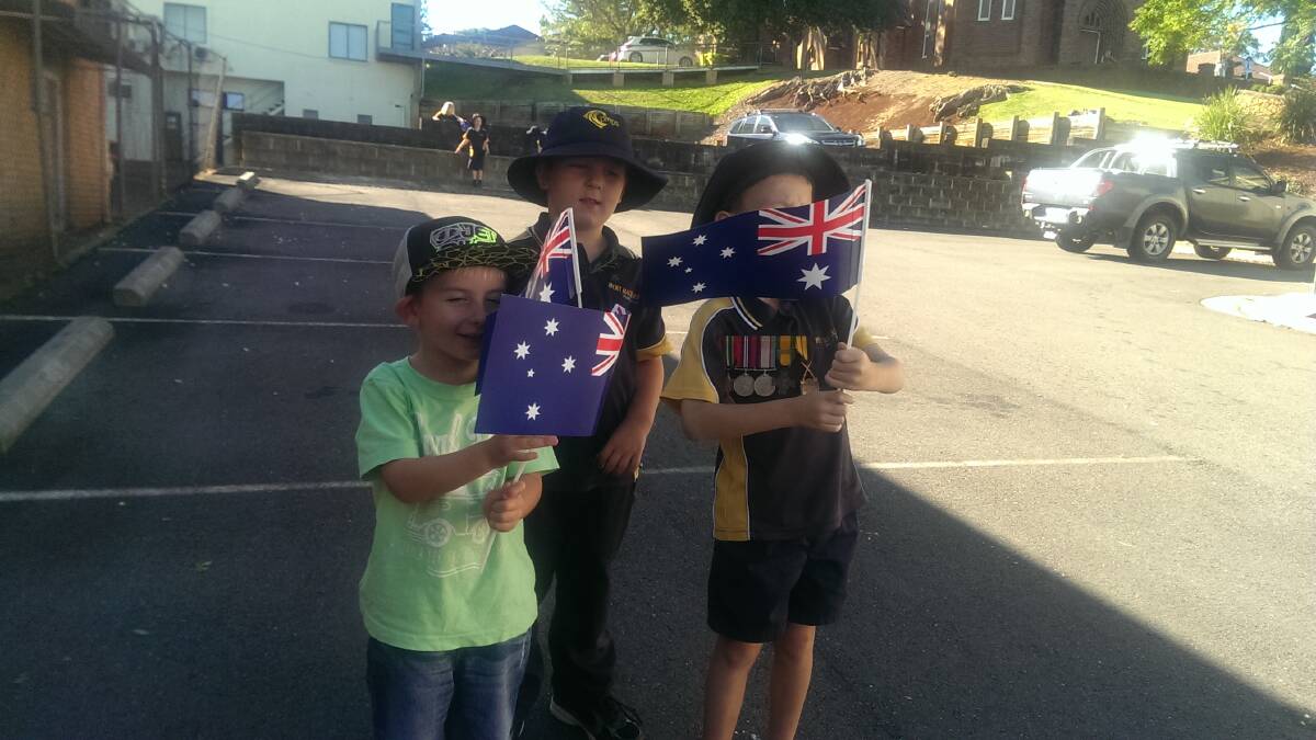Kye Dale, Jack Dale and Jaiden Turnbull prepare for the main march on Anzac Day 2015. Pic: Lisa Tisdell
