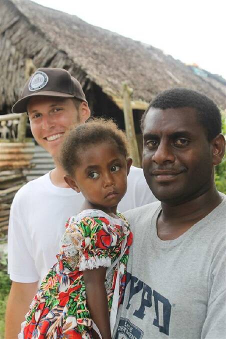 Strong ties: One of the instructors Perez Wai (right) and his daughter Leila, with Henry
Whitehead in Mele Village.