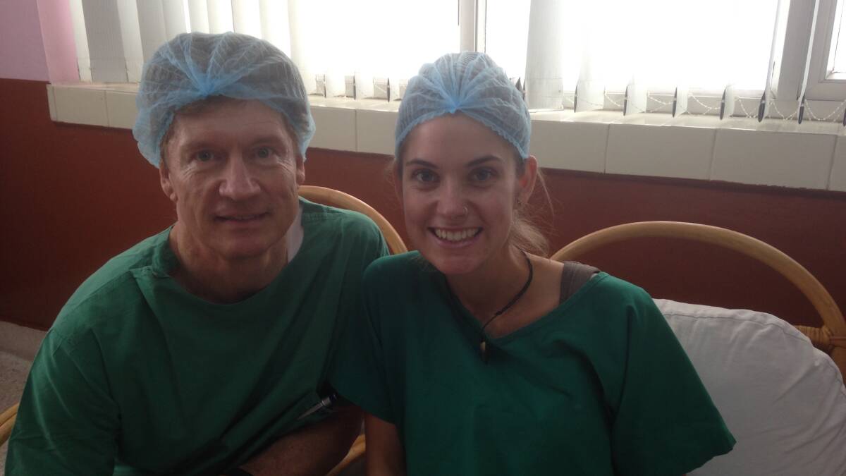  Dr Ray Hodgson pictured with his his daughter Eloise Woods as she prepared to observe an operation in Nepal. Pic: Supplied