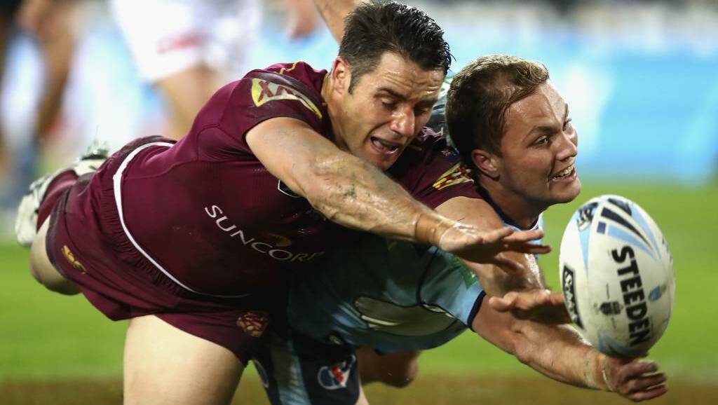 Cooper Cronk and Matt Moylan contest the ball. Pic: Getty Images
