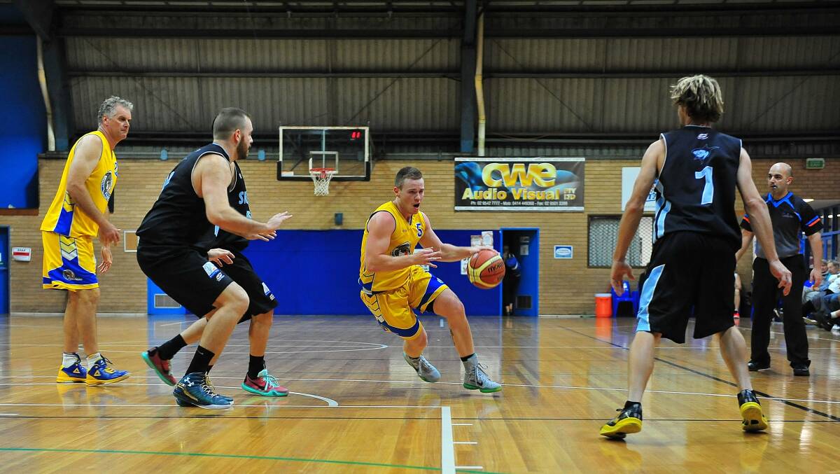 On the attack: Luke Martin drives to the basket for the Dolphins. Pic: NOEL ROWSELL