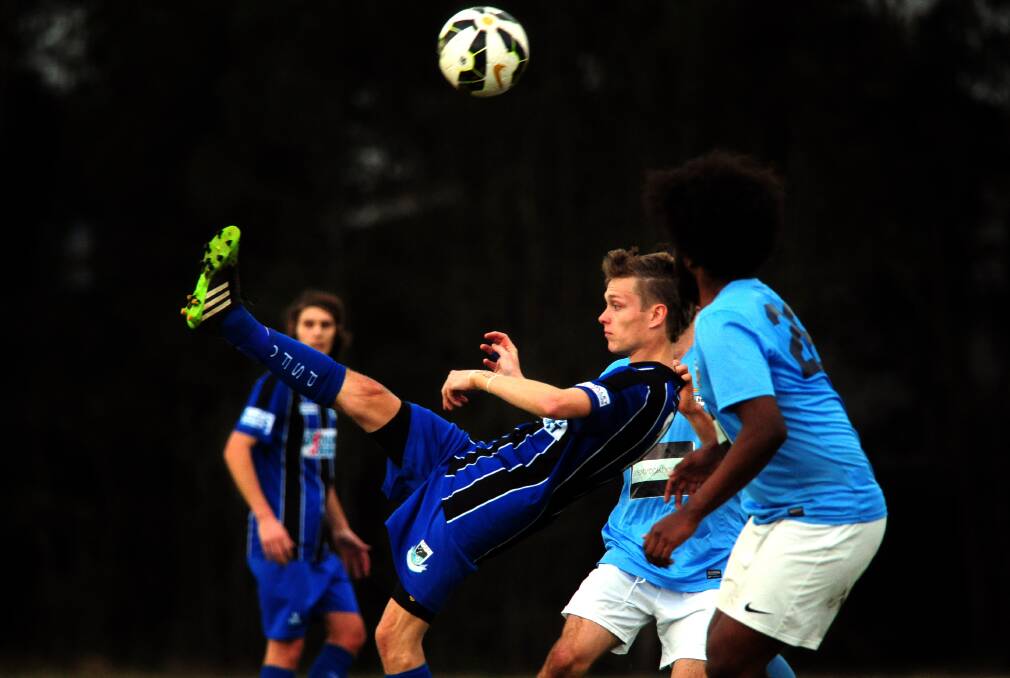 Overhead kick: Michael Bishop in action for Saints against Port FC.