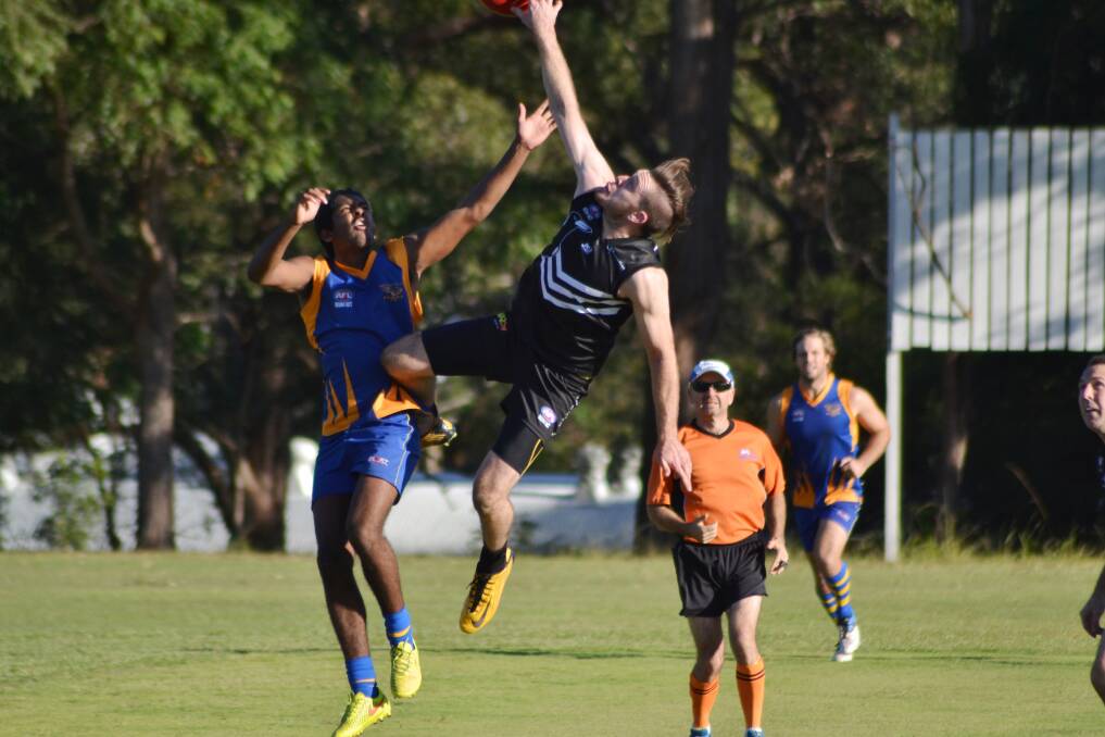 High leap: Ben Manton in action for Port Magpies on Saturday. Pic: DONNA LYNCH