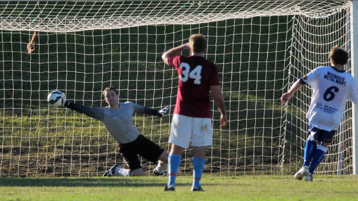 In vain: Terrance Stafford dives but can't stop a penalty for FC. His team takes on Wildcats on Saturday.