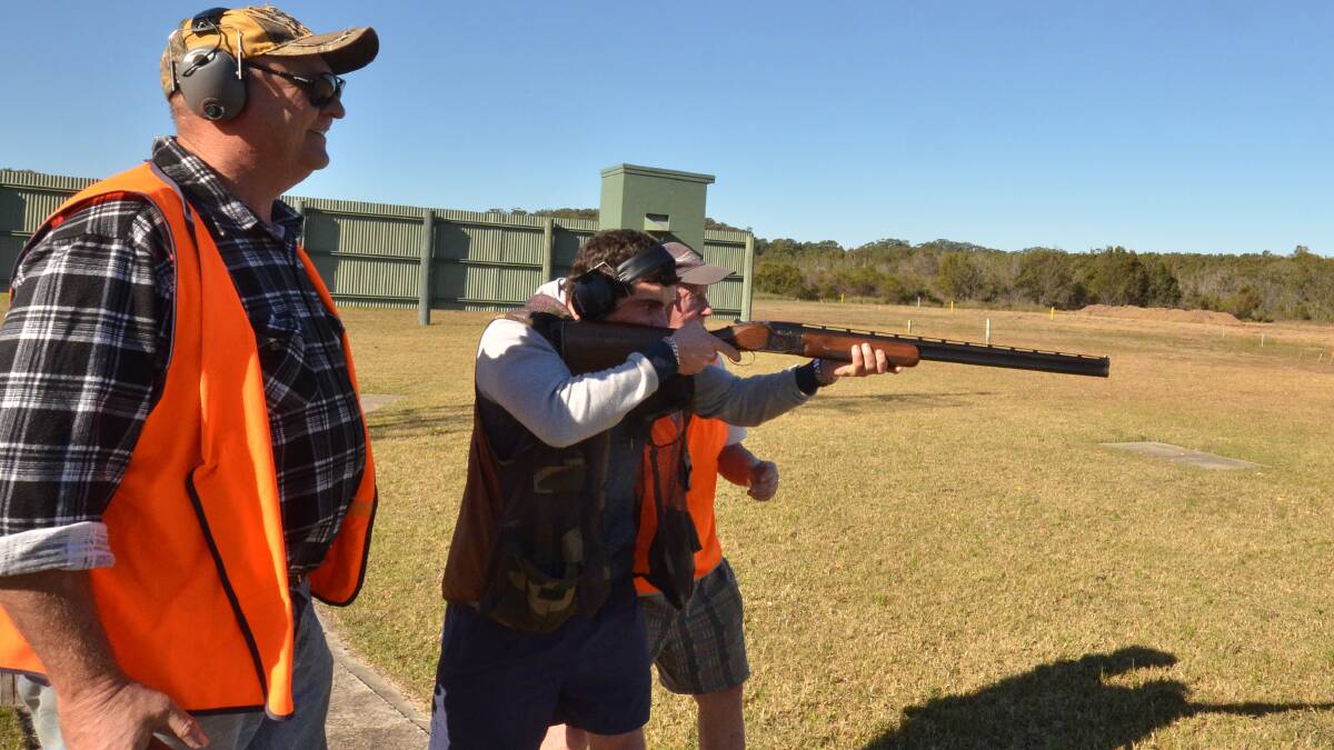 Ready. Aim. Fire: Phil Townsend with Westport High student Bryson Hamilton at the Hastings Regional Shooting Complex. 