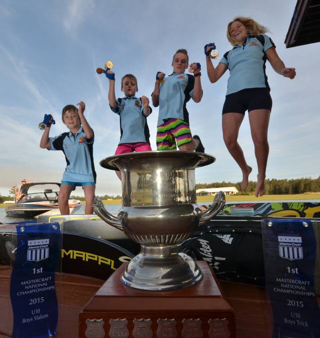 Bucket load: Regan, Ben, Jayden and Briana McGrady celebrate the mass of medals the four won recently.
Pic: NIGEL McNEIL
