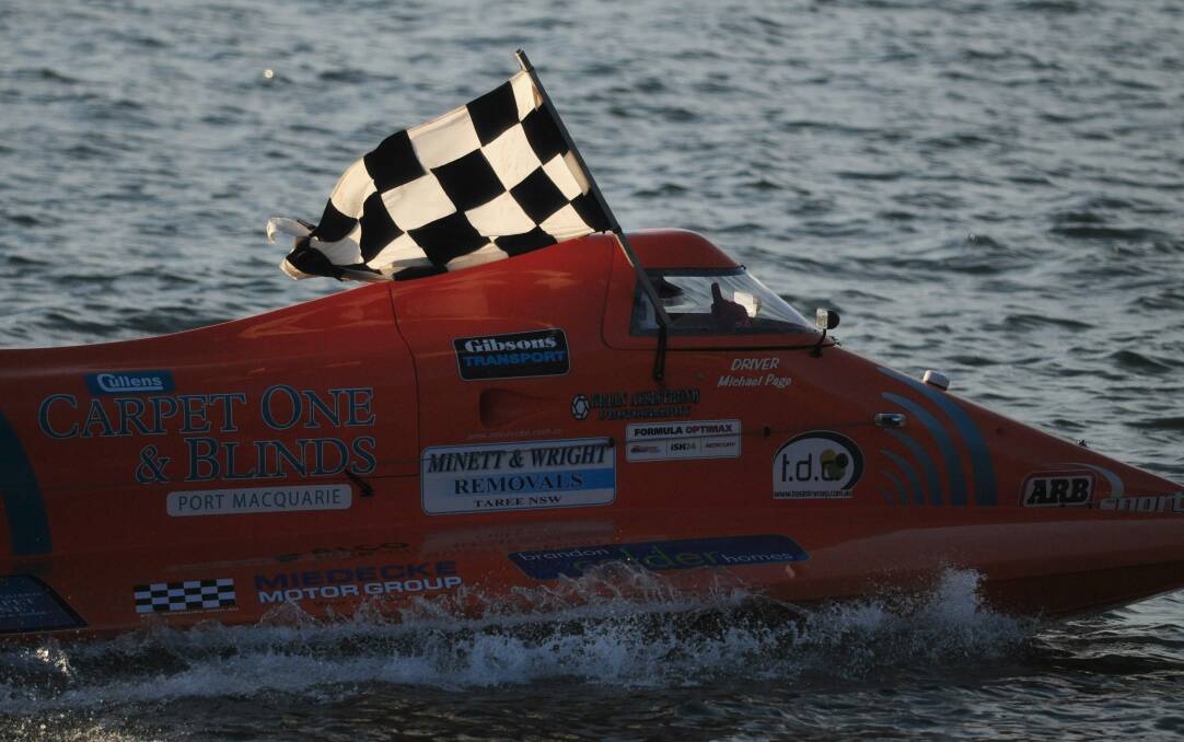 Chequered flag: Michael Page takes victory in the formula optimax class on Sunday. Pic: MATT McLENNAN