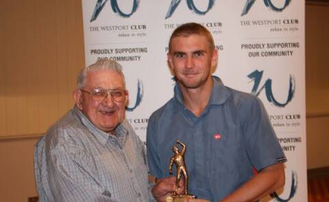 Arthur Hollis presents Wauchope's Andrew Murrell with an award at a Hastings River District Cricket Association presentation night. Hollis has passed away.