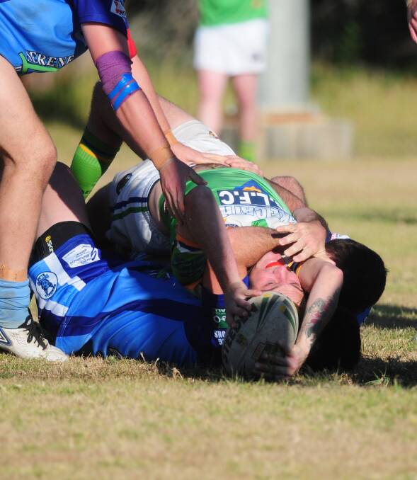 One of many: Lake Cathie Raiders fullback Steve Bowes twists his body for a try.