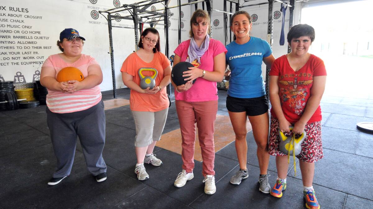 ACES service users, Carlie Culf, Chloe Kirkman, Sam Rolfe and Crossfit 2444 trainer Laura Dekker with Jessica Beresfed during a training session last week. Not pictured: Lisa Jones, Stephanie Gunn and Adam Beck.