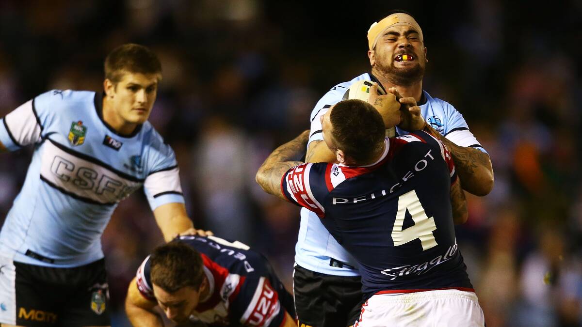 Andrew Fifita of the Sharks runs the ball during the round seven NRL match between the Cronulla-Sutherland Sharks and the Sydney Roosters at Remondis Stadium on April 19, 2014 in Sydney, Australia. Photo: Mark Nolan/Getty Images.