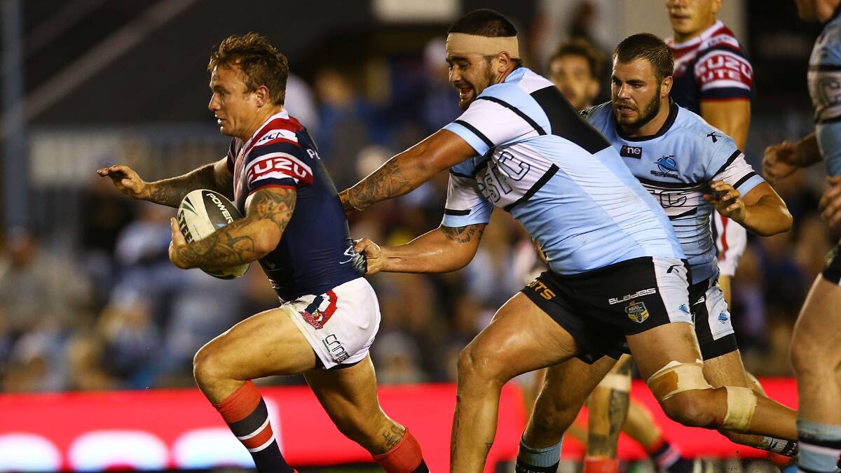  Jake Friend of the Roosters makes a line break during the round seven NRL match between the Cronulla-Sutherland Sharks and the Sydney Roosters at Remondis Stadium on April 19, 2014 in Sydney, Australia. Photo: Mark Nolan/Getty Images.