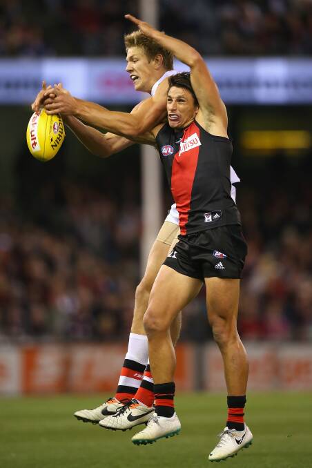 Rhys Stanley of the Saints and Mark Baguley of the Bombers compete for a mark during the round five AFL match between the Essendon Bombers and the St Kilda Saints at Etihad Stadium on April 19, 2014 in Melbourne, Australia. Photo: Quinn Rooney/Getty Images.