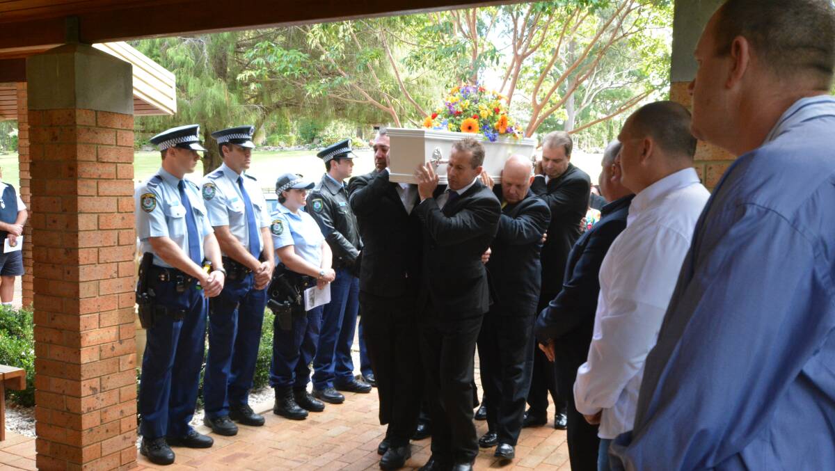 Farewell: the cheeky boy who has grown his angel wings and left us behind is carried into the chapel with his father Justin leading at left. Pic: MATT ATTARD