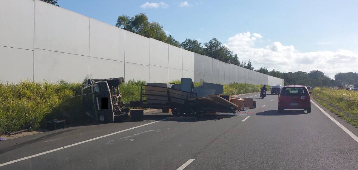 Out of action: the wrecked trailer with its spilled load beside the Hilux on Thursday afternoon. 