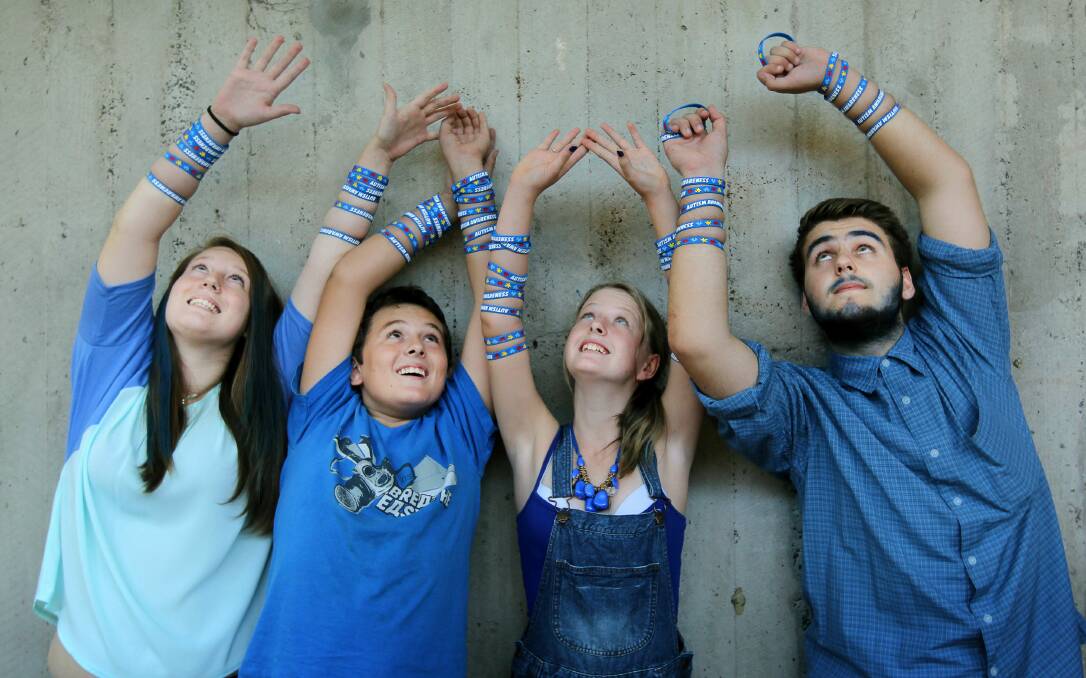 Lake Illawarra High School students Tamara, Kallan, Jade and Joshua dressed up in blue and sold wristbands and bandanas to raise awareness and funds for World Autism Day on Wednesday. Picture: SYLVIA LIBER