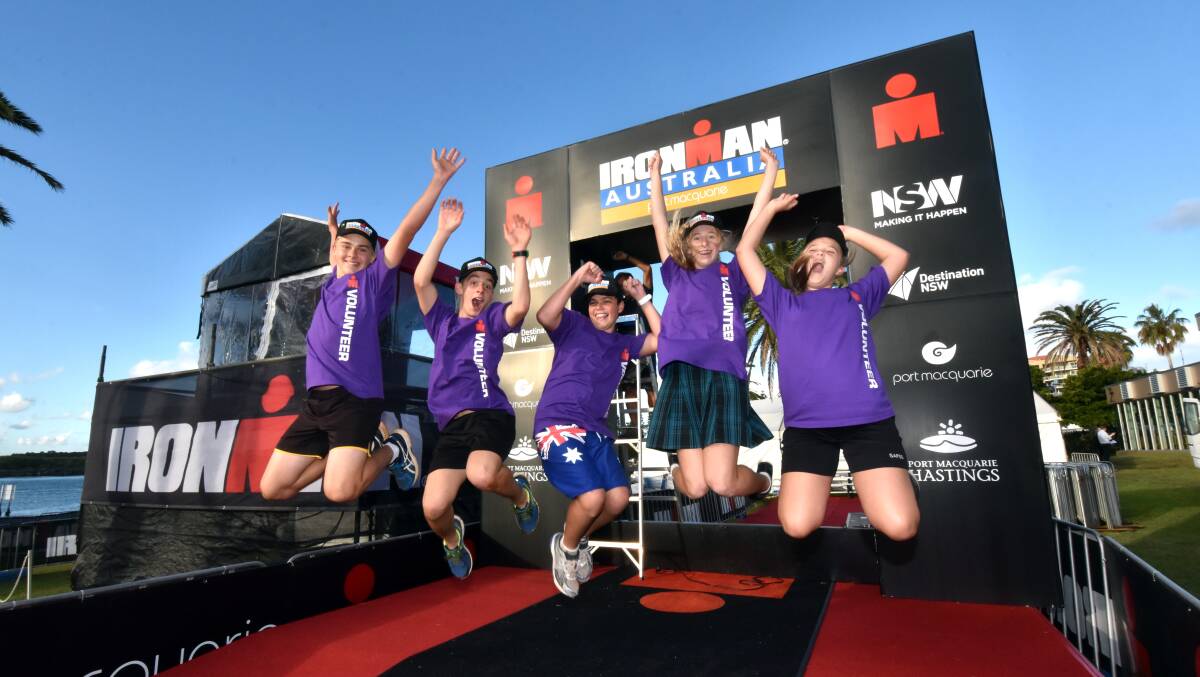 Ironman support: Zac Lawrence, Daniel Ward, TJ Avery, Laura Dean and Kirra Tuckwell celebrating their involvement as Ironman Australia Port Macquarie volunteers. Sunday's event has attracted about 2400
athletes for the full and half Ironman events. Pic: PETER GLEESON
